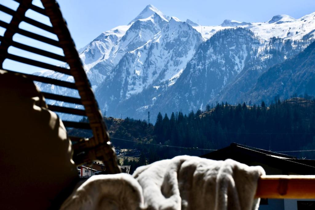 a view of a snow covered mountain range from a ladder at Boutique Hotel Pinzgauerhof in Kaprun