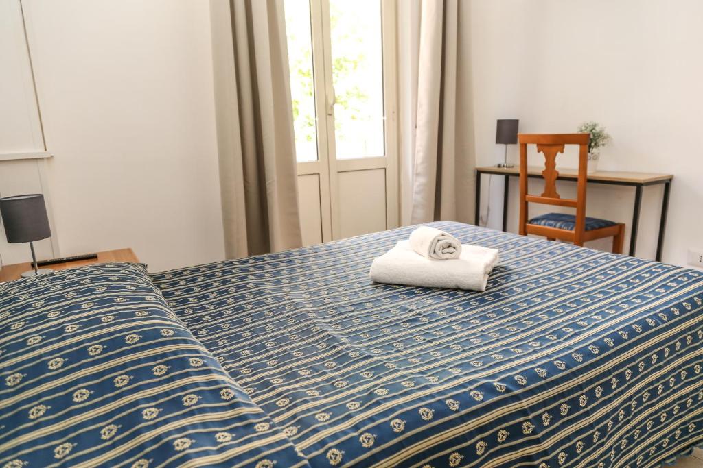 Postel nebo postele na pokoji v ubytování Albergo Athena