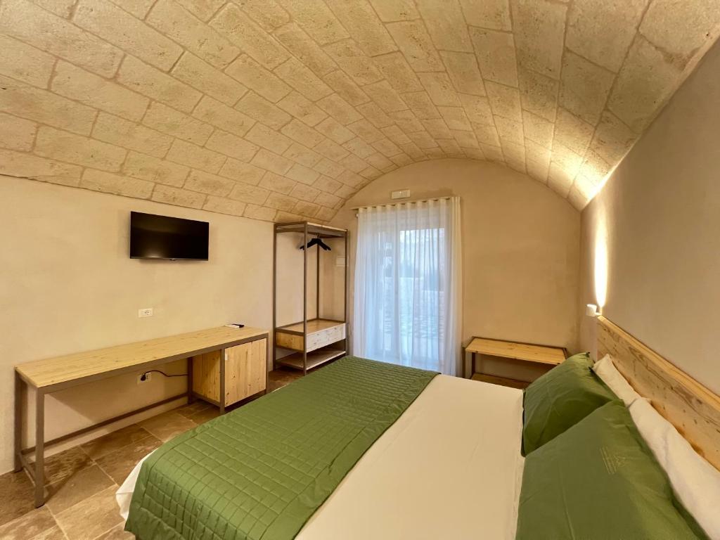 TV a/nebo společenská místnost v ubytování Masseria Castelluzzo