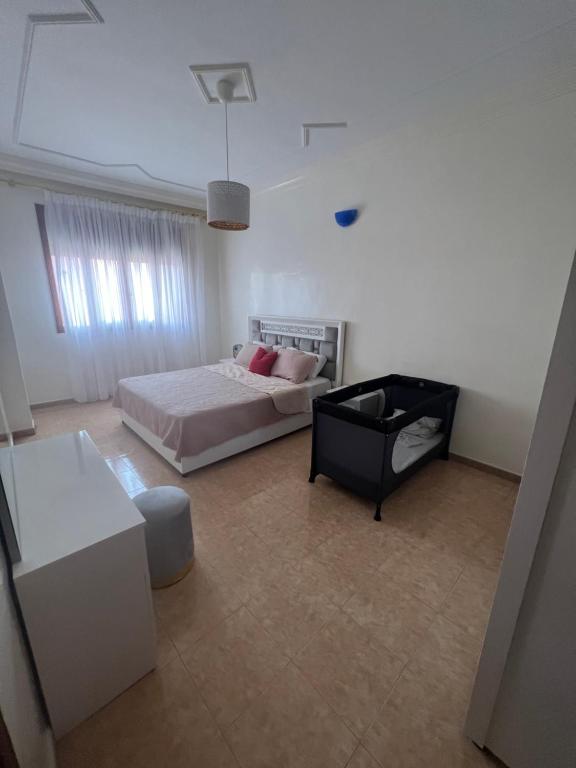 Postel nebo postele na pokoji v ubytování Appartement vue sur mer - Al Hoceima