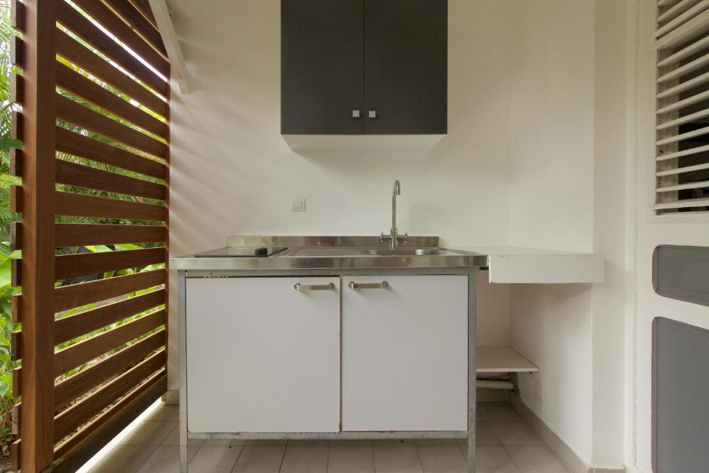 Kuchyň nebo kuchyňský kout v ubytování Orcéa & Spa Séjours Ecofriendly
