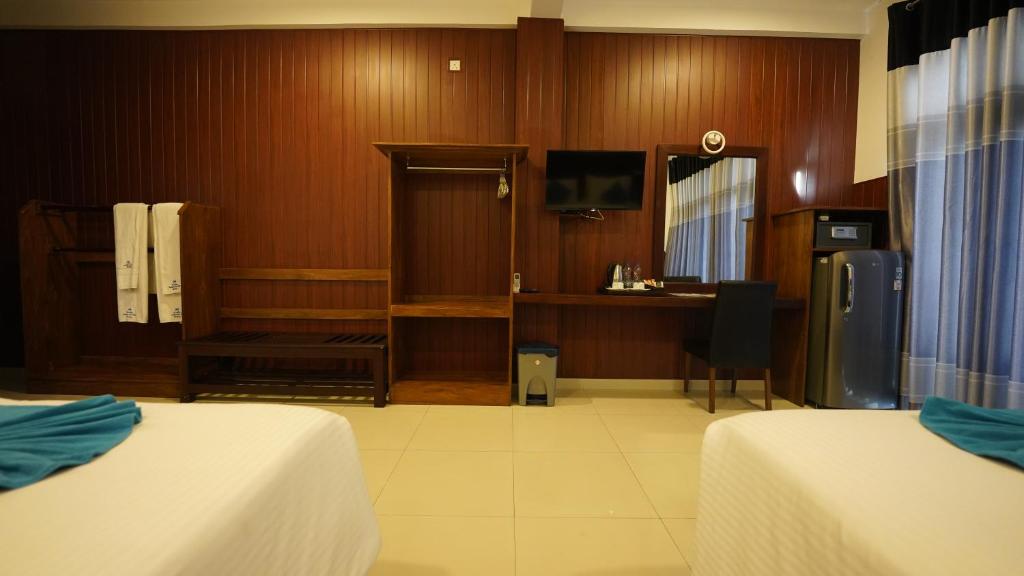 Postel nebo postele na pokoji v ubytování Randiya Sea View Hotel