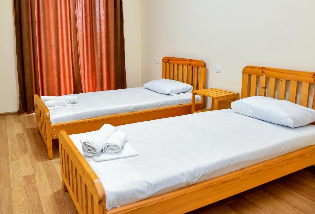 Postel nebo postele na pokoji v ubytování Just Inn Kutaisi