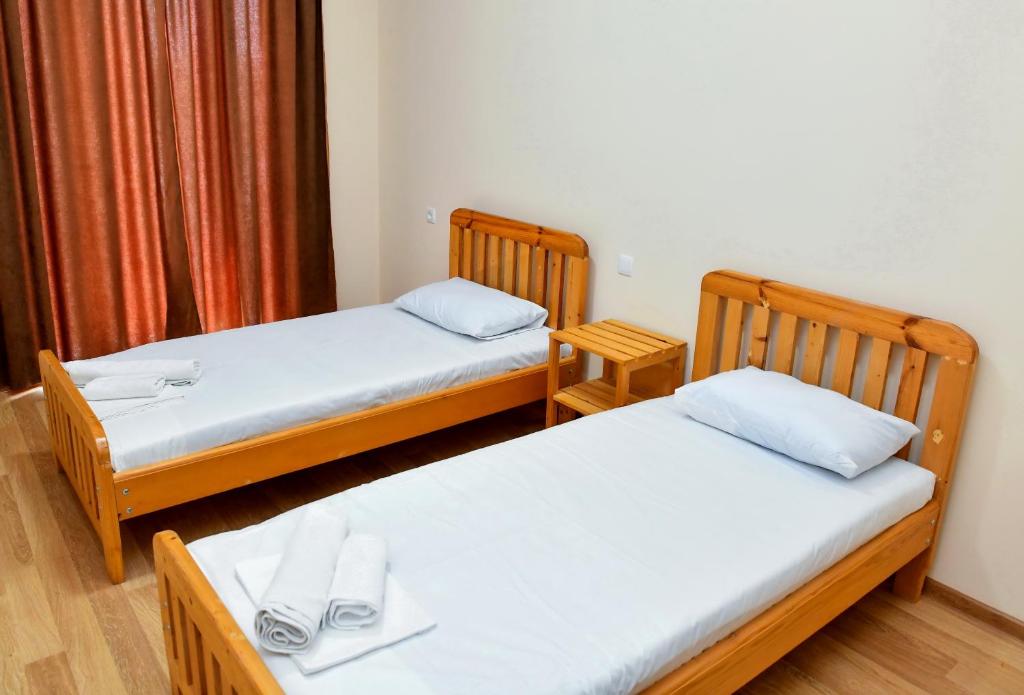 Postel nebo postele na pokoji v ubytování Just Inn Kutaisi