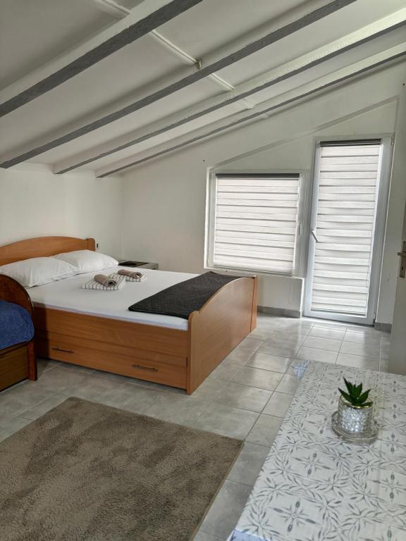 Postel nebo postele na pokoji v ubytování Apartman Sava