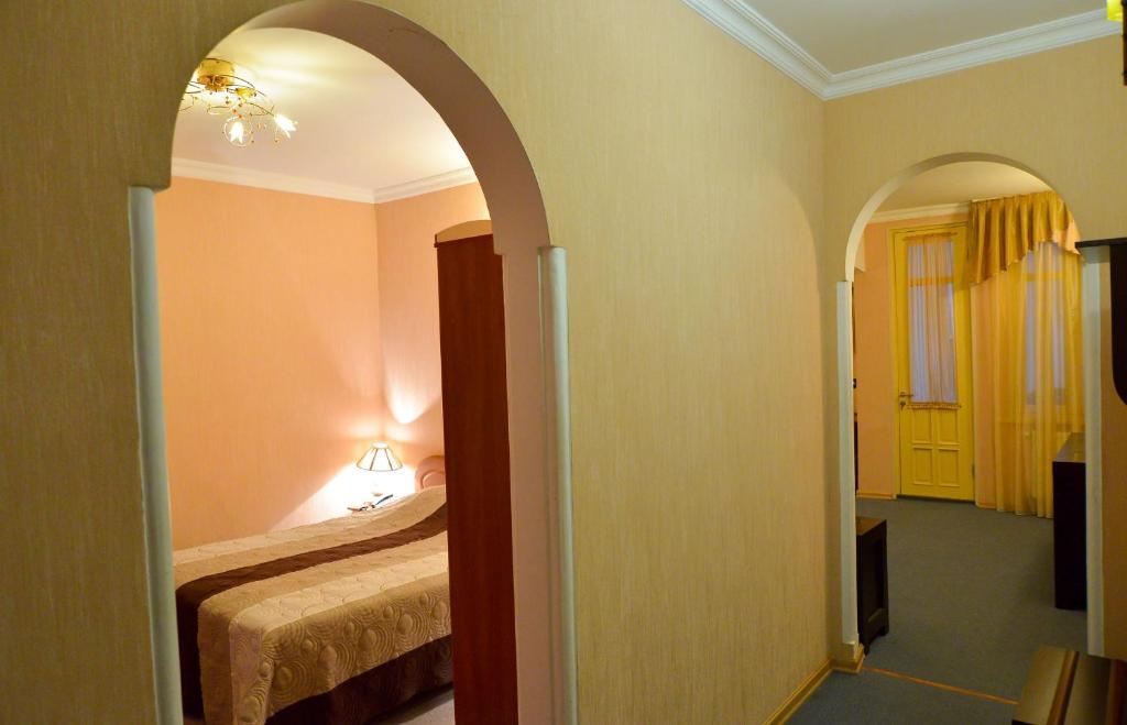 Postel nebo postele na pokoji v ubytování Hotel Old Town