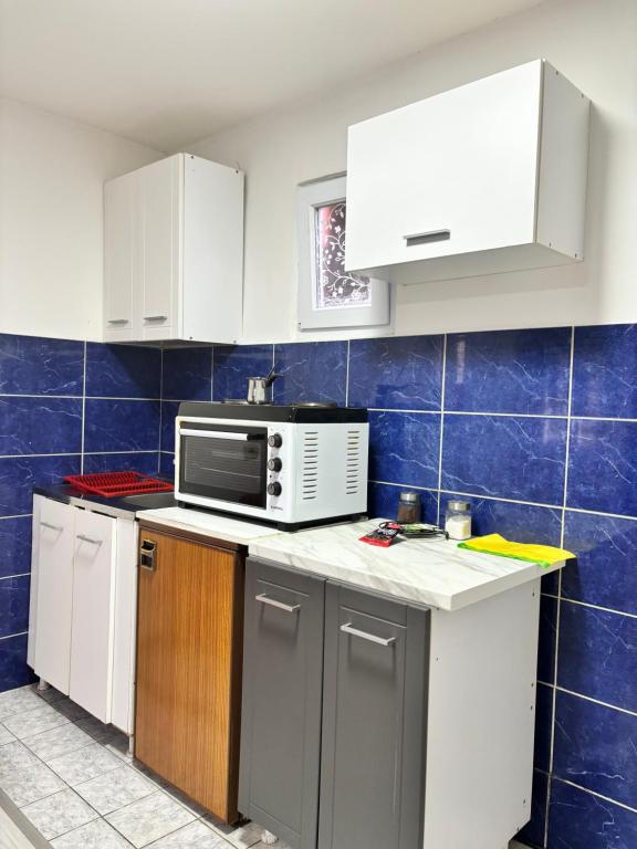 Kuchyň nebo kuchyňský kout v ubytování Apartman Sava