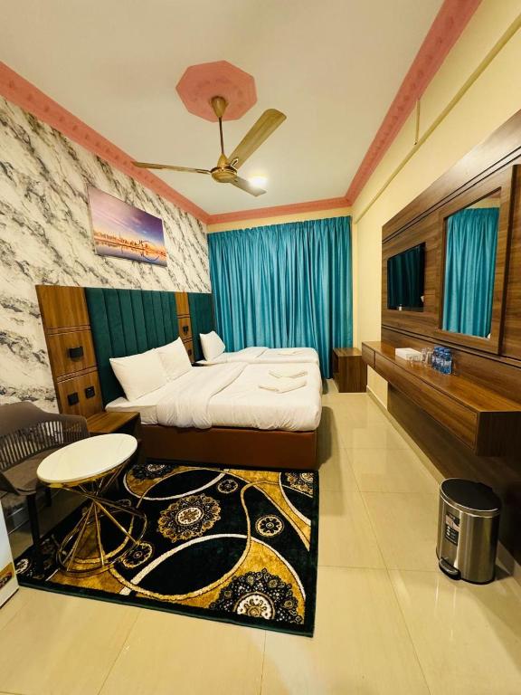 Postel nebo postele na pokoji v ubytování Three Dot Hotel