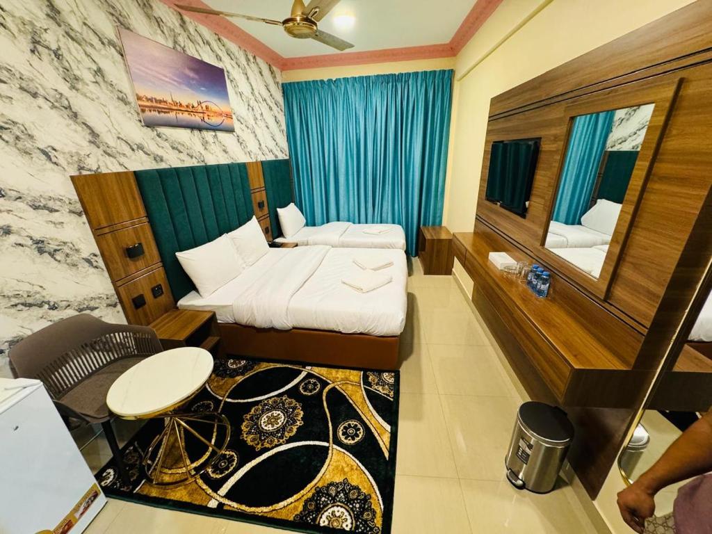 Postel nebo postele na pokoji v ubytování Three Dot Hotel