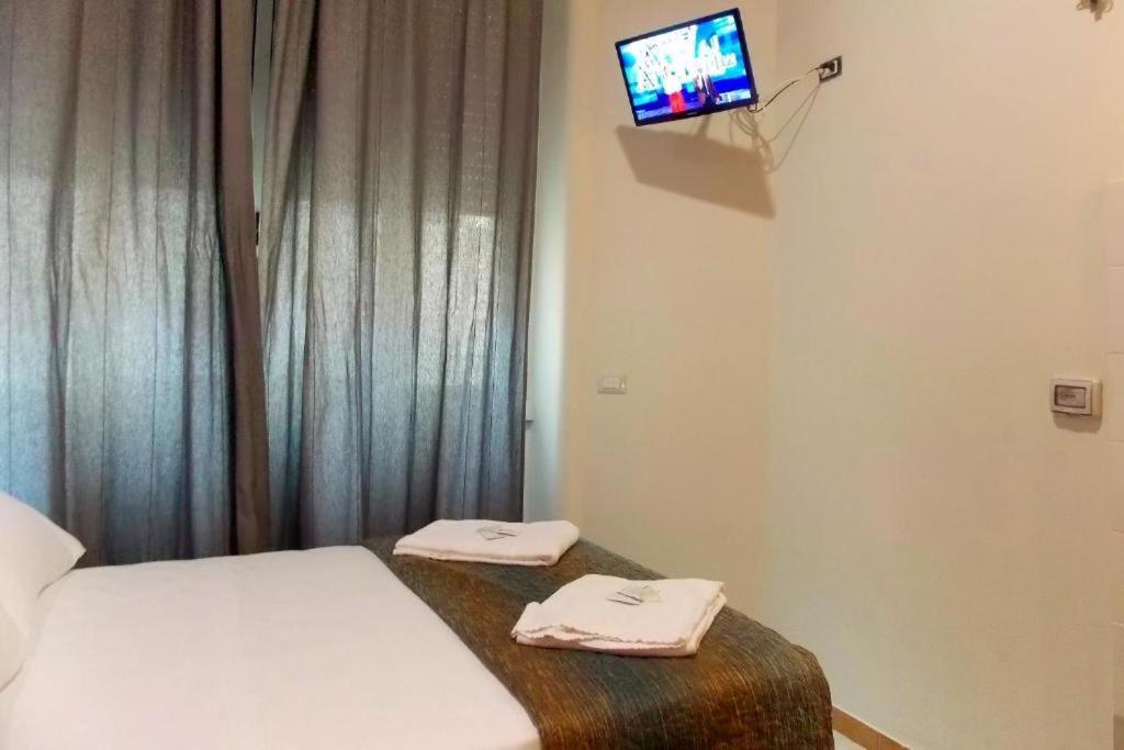 Postel nebo postele na pokoji v ubytování Hotel Midtown Milano