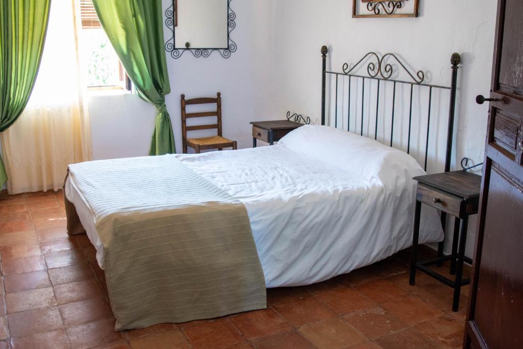 Postel nebo postele na pokoji v ubytování Cortijo del Coco