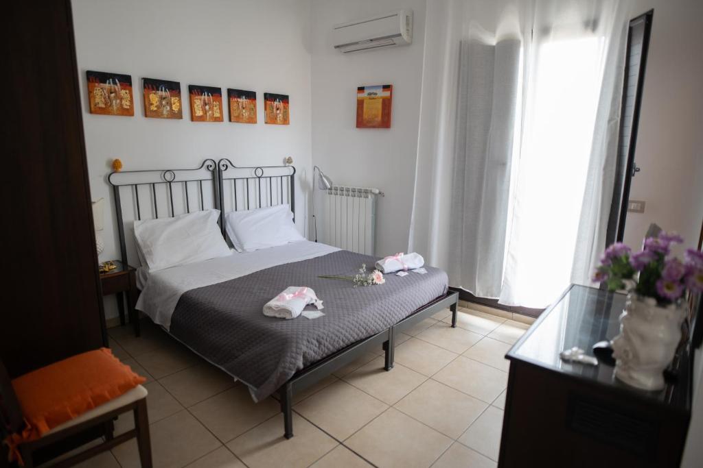 Postel nebo postele na pokoji v ubytování B&B Regina Carolina