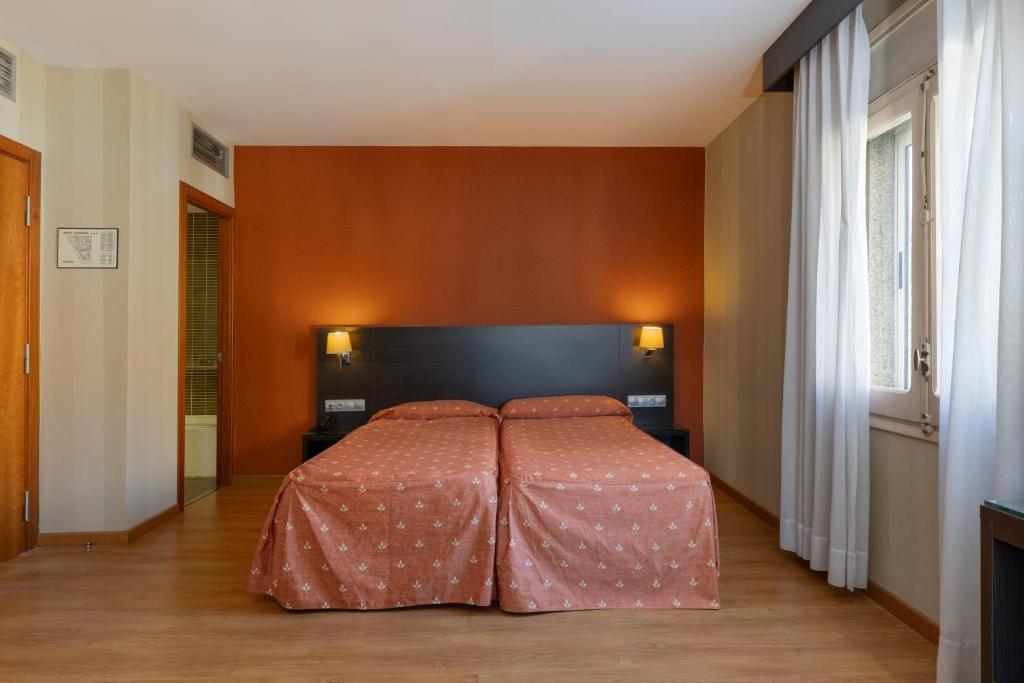 Postel nebo postele na pokoji v ubytování Hotel Casanova