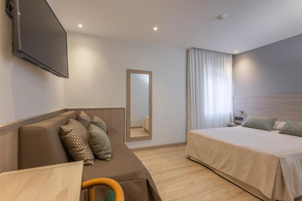 Postel nebo postele na pokoji v ubytování Hotel Casanova
