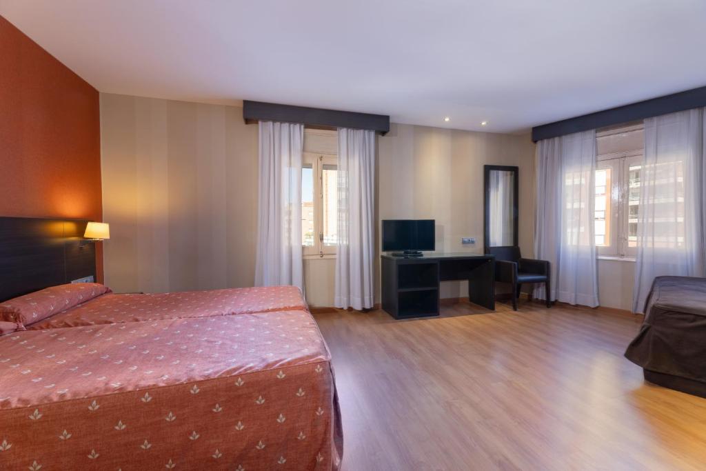 Postel nebo postele na pokoji v ubytování Hotel Casanova