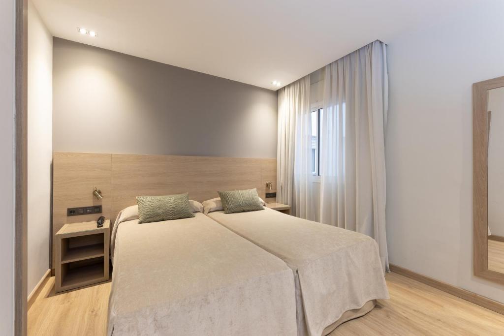 Postel nebo postele na pokoji v ubytování Hotel Casanova