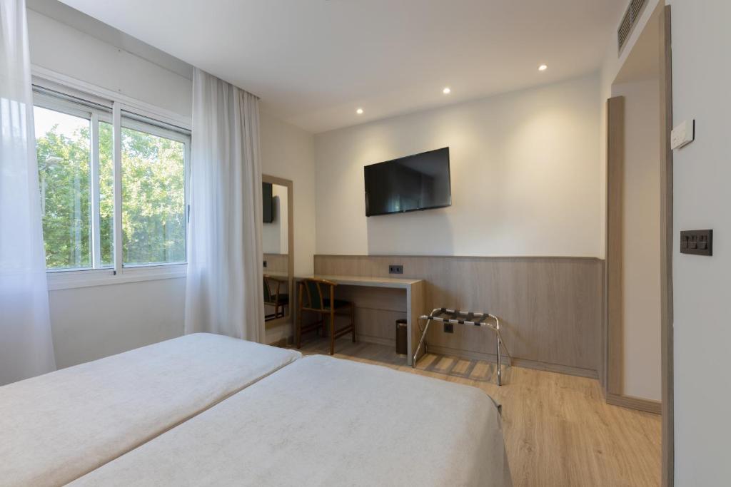 Postel nebo postele na pokoji v ubytování Hotel Casanova