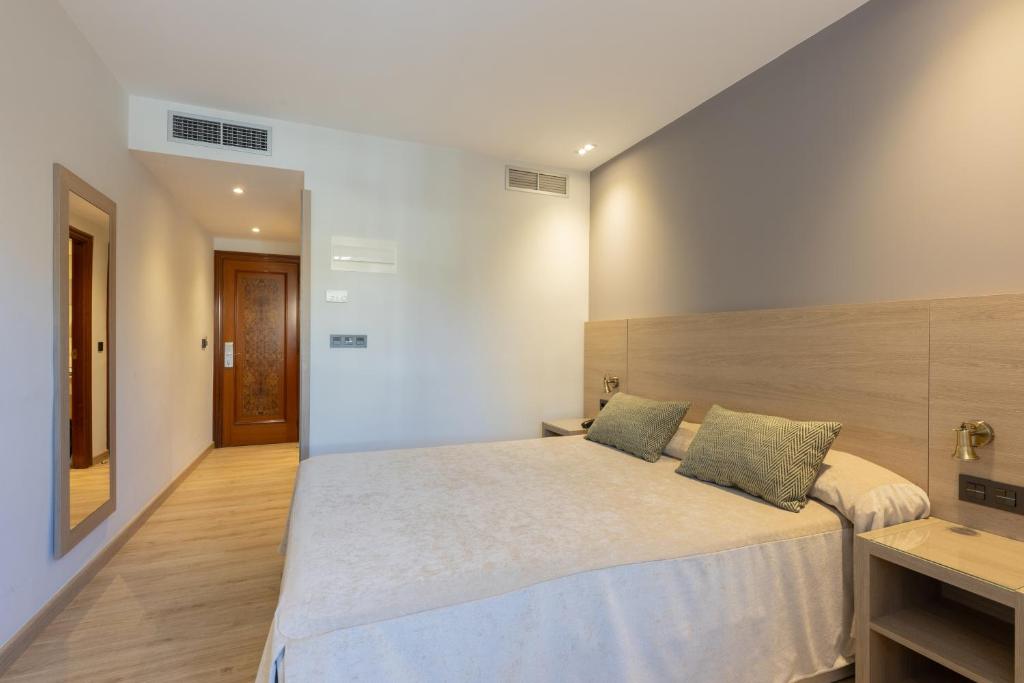 Postel nebo postele na pokoji v ubytování Hotel Casanova