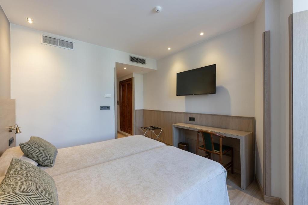 Postel nebo postele na pokoji v ubytování Hotel Casanova
