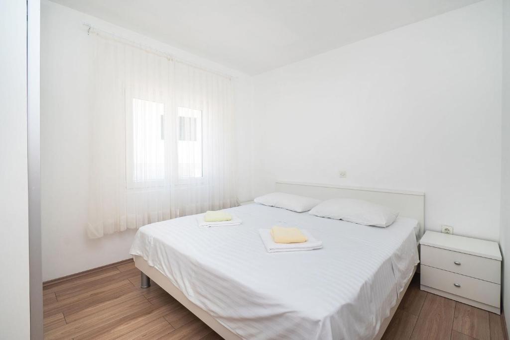 Postel nebo postele na pokoji v ubytování Apartment Ljuba