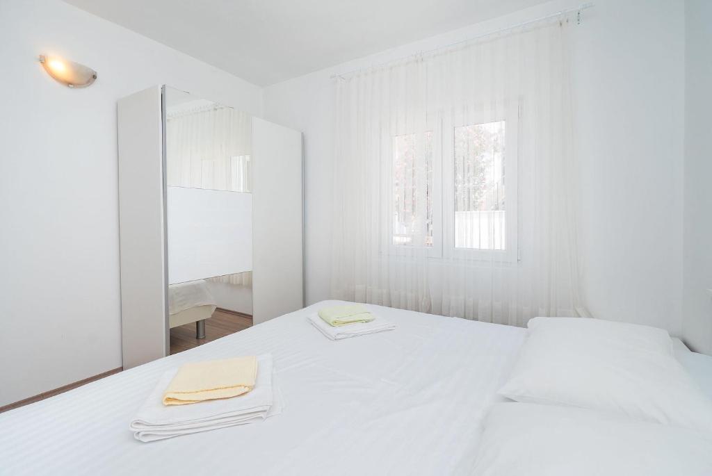 Postel nebo postele na pokoji v ubytování Apartment Ljuba