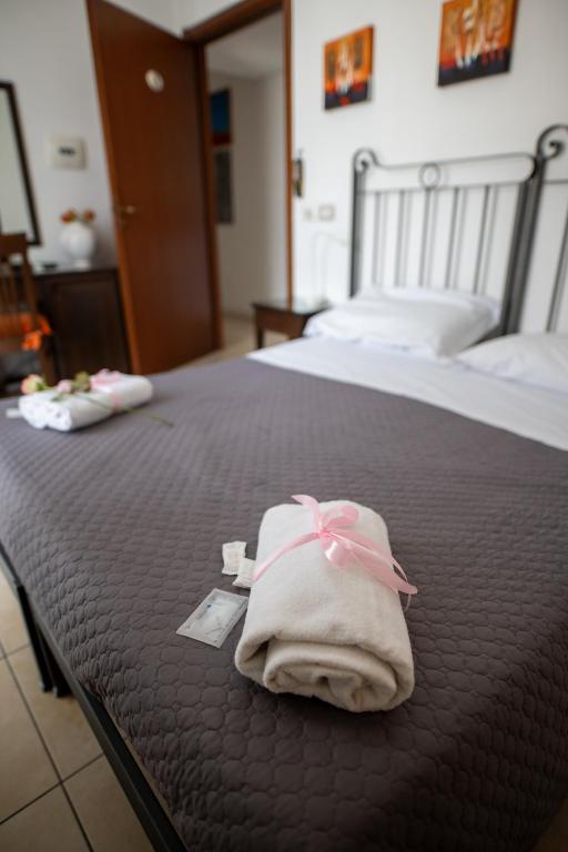 Postel nebo postele na pokoji v ubytování B&B Regina Carolina