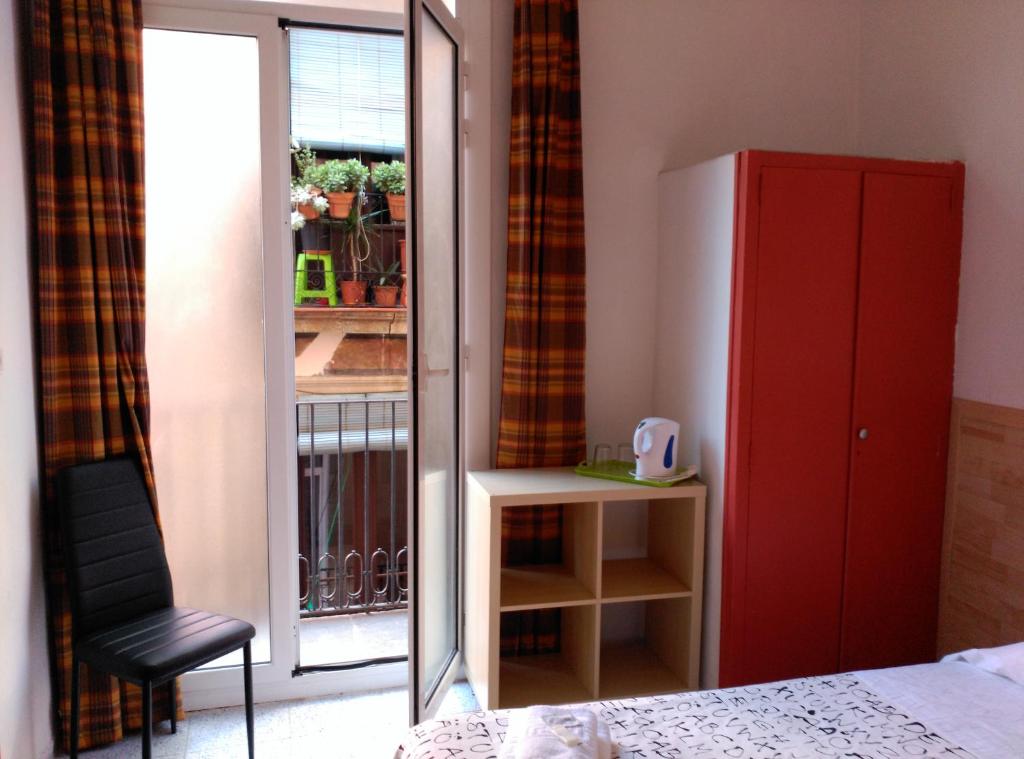 Postel nebo postele na pokoji v ubytování Hostal River