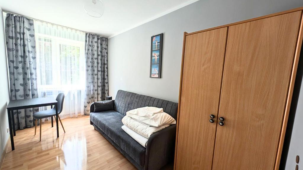 Posteľ alebo postele v izbe v ubytovaní Apartament Piernikowe Serce