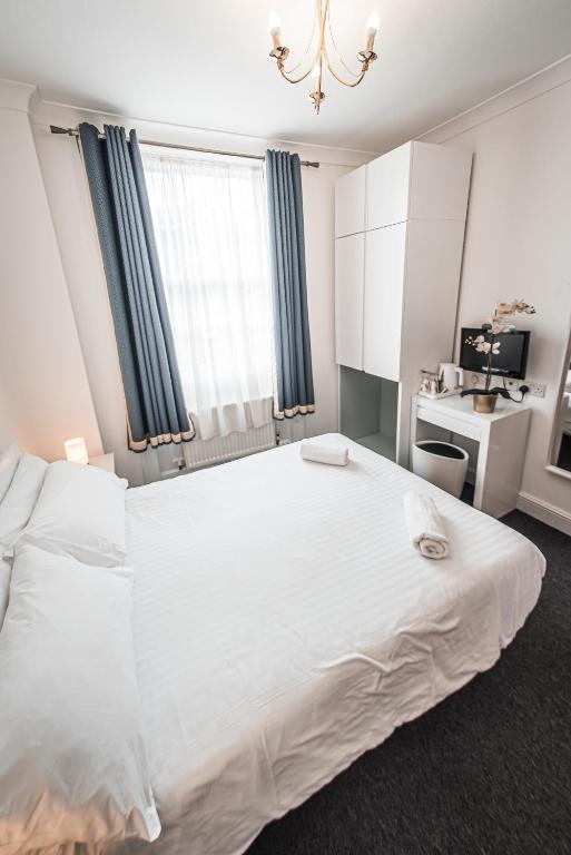 Letto o letti in una camera di Hotel Meridiana