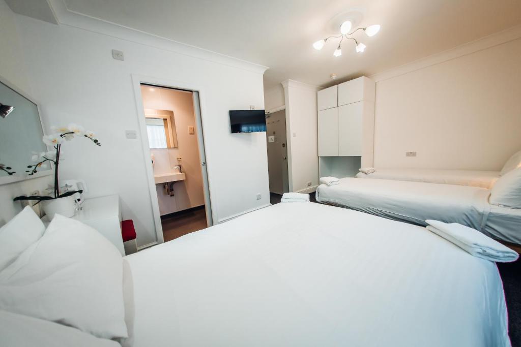 Letto o letti in una camera di Hotel Meridiana
