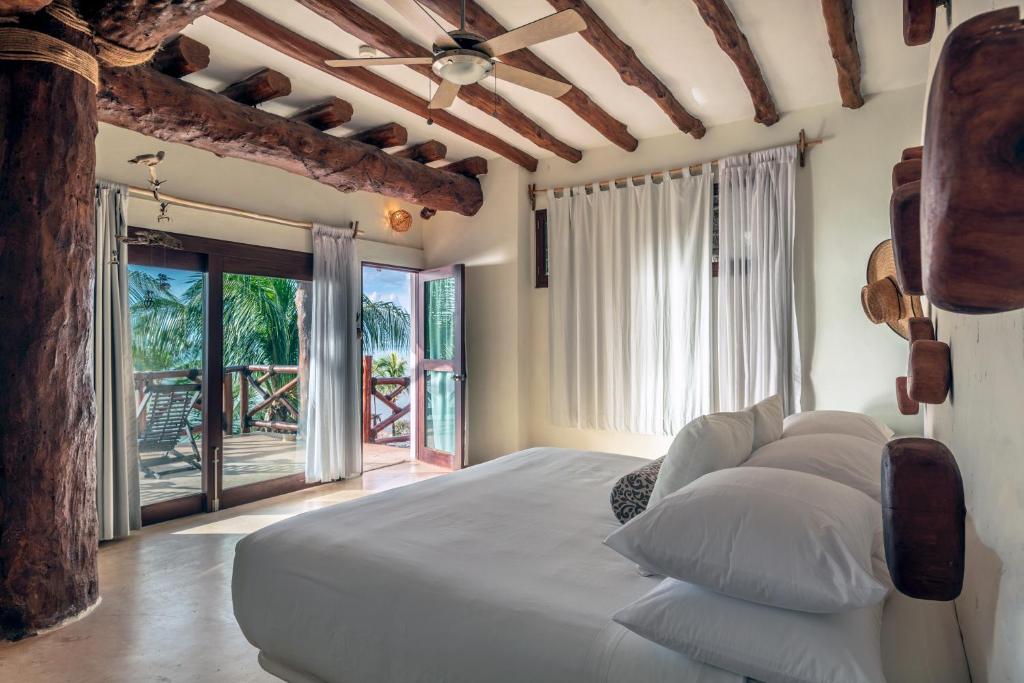 Postel nebo postele na pokoji v ubytování Hotel Villas Flamingos