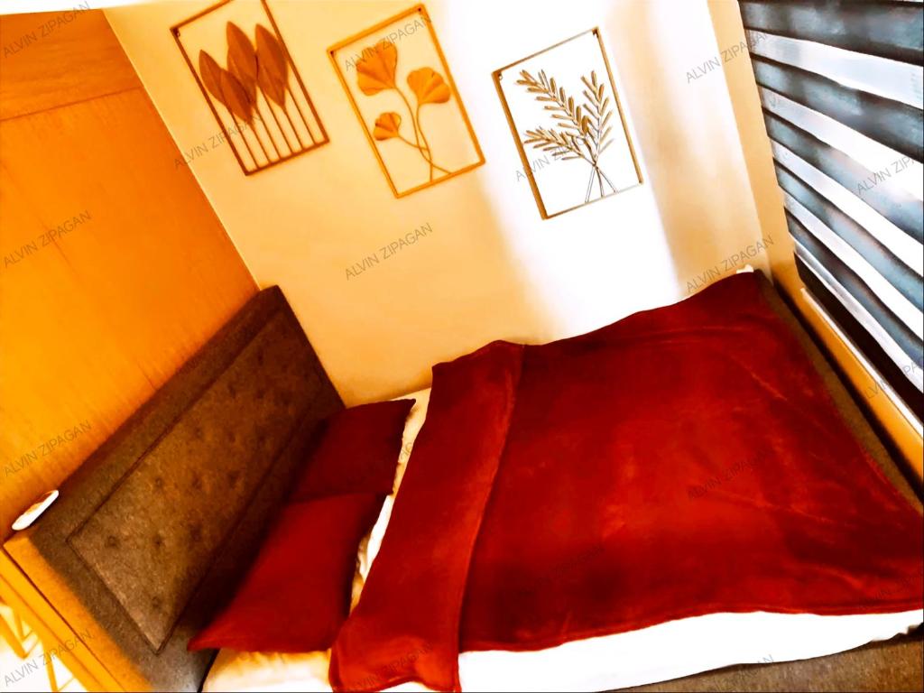 Postel nebo postele na pokoji v ubytování The Grass Residences