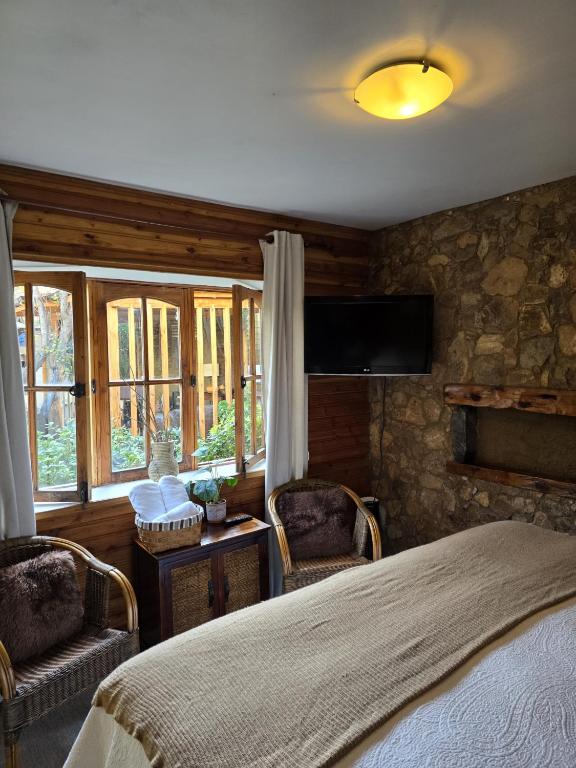 Postel nebo postele na pokoji v ubytování Hotel Boutique Terra Diaguita & Spa