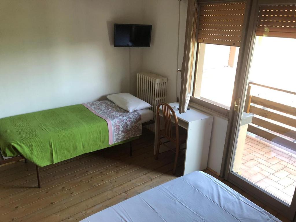 Posteľ alebo postele v izbe v ubytovaní Oasi Franciacorta