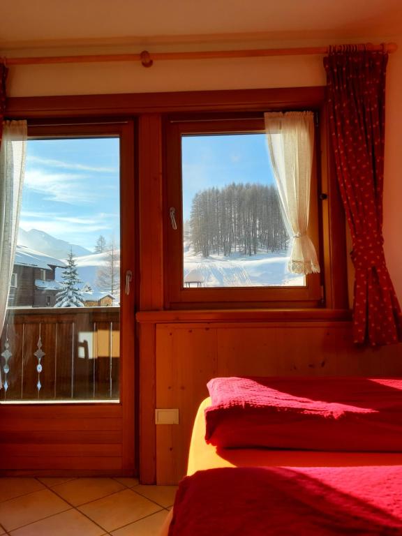Posteľ alebo postele v izbe v ubytovaní Chalet Beatrice