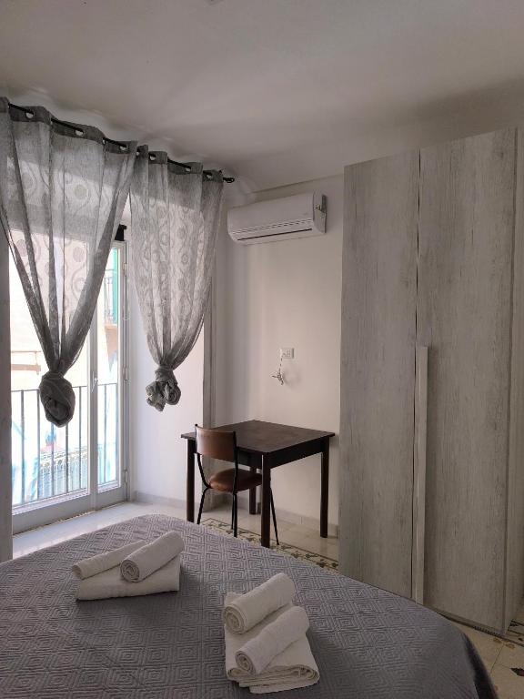 Łóżko lub łóżka w pokoju w obiekcie Casa di Nick