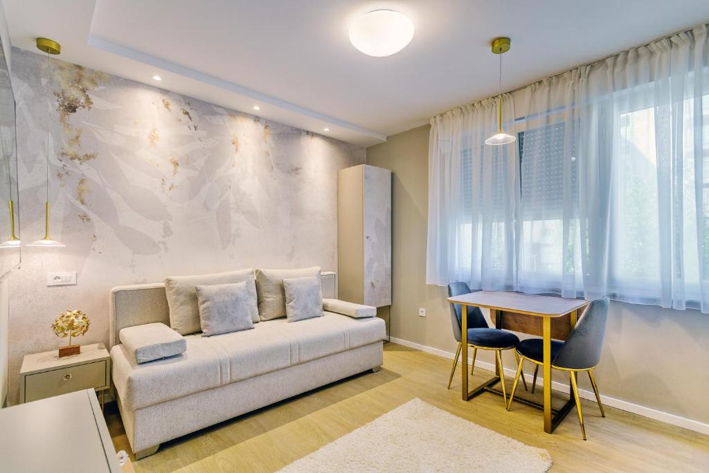 a living room with a couch and a table at Stylish apartments - near Zadar bridge in Zadar