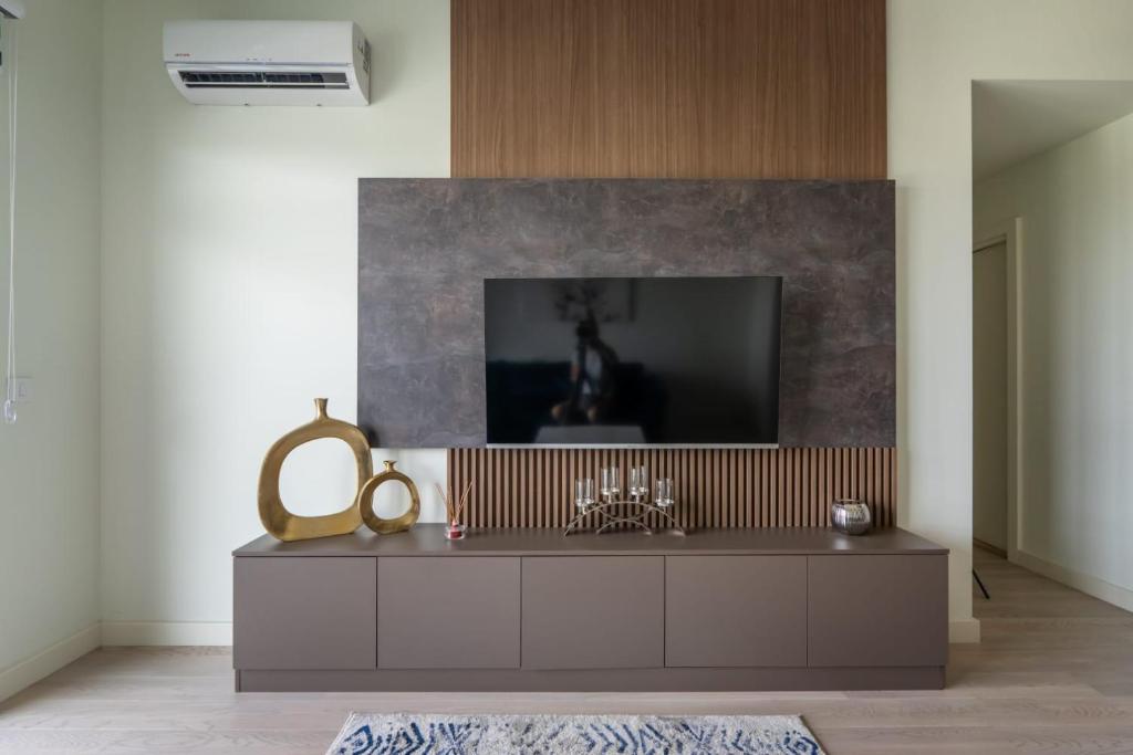 TV a/nebo společenská místnost v ubytování Libera Luxe Residence