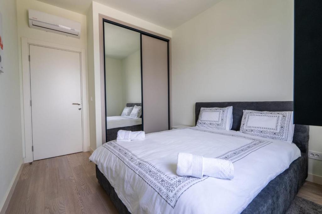 Postel nebo postele na pokoji v ubytování Libera Luxe Residence