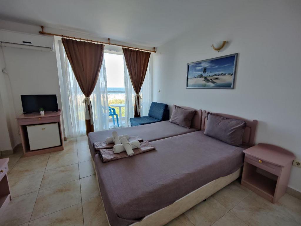 Postel nebo postele na pokoji v ubytování Hotel Joker