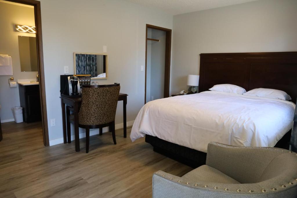 Postel nebo postele na pokoji v ubytování Skylite Motel