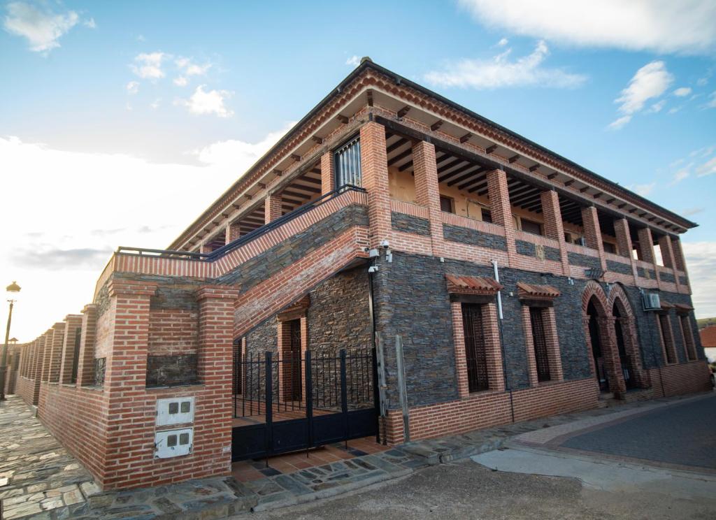 an old brick building on a street at Villas de Miranda in Miranda de Azán