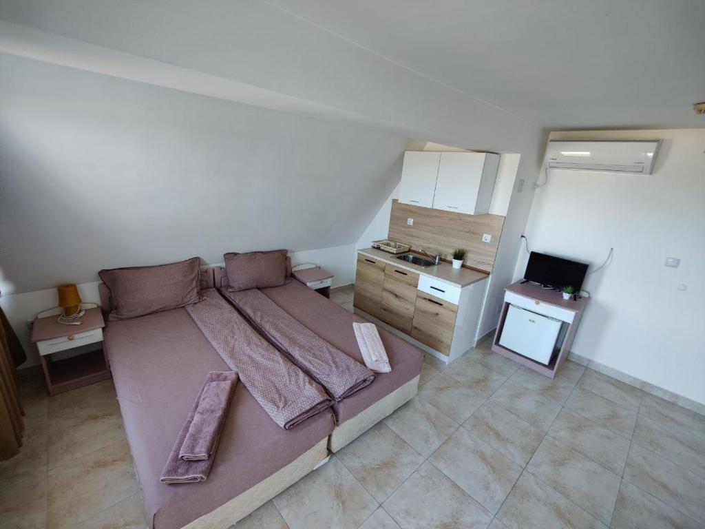 Kuchyň nebo kuchyňský kout v ubytování Hotel Joker