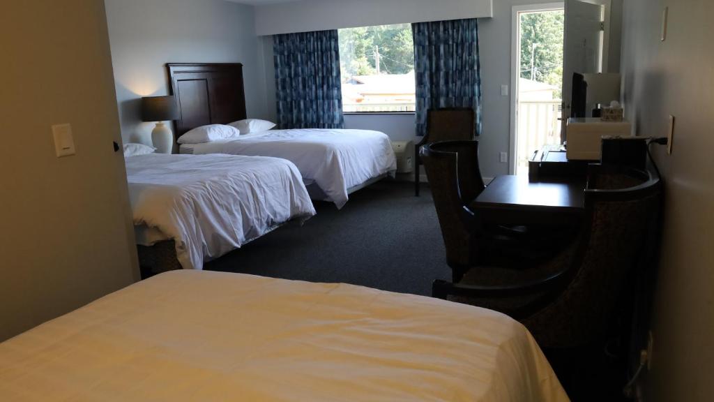 Postel nebo postele na pokoji v ubytování Skylite Motel