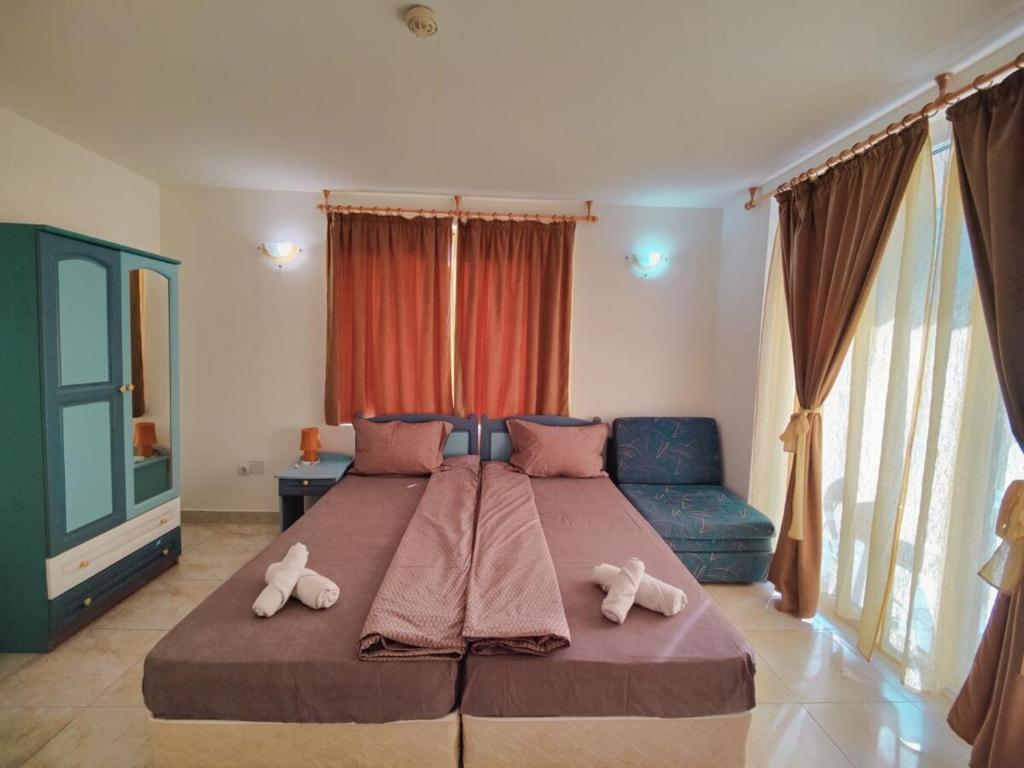 Postel nebo postele na pokoji v ubytování Hotel Joker