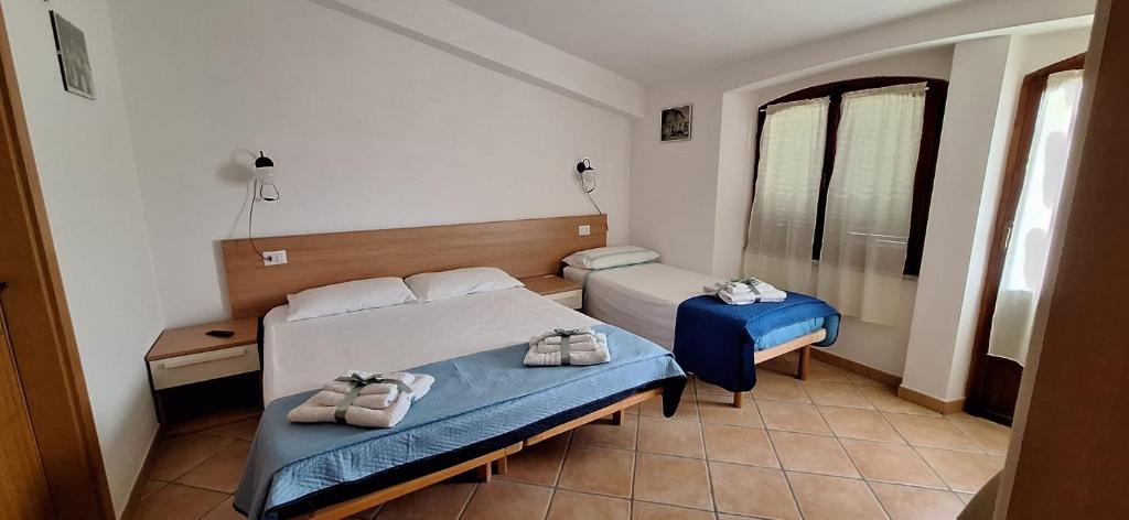 Postel nebo postele na pokoji v ubytování Nurache