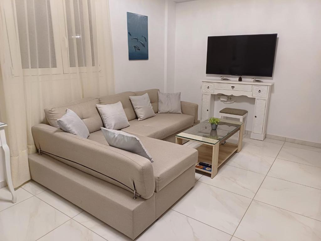 A television and/or entertainment centre at Filocsenia luxury apartment at tsoutsouras