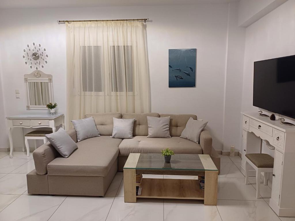 A television and/or entertainment centre at Filocsenia luxury apartment at tsoutsouras