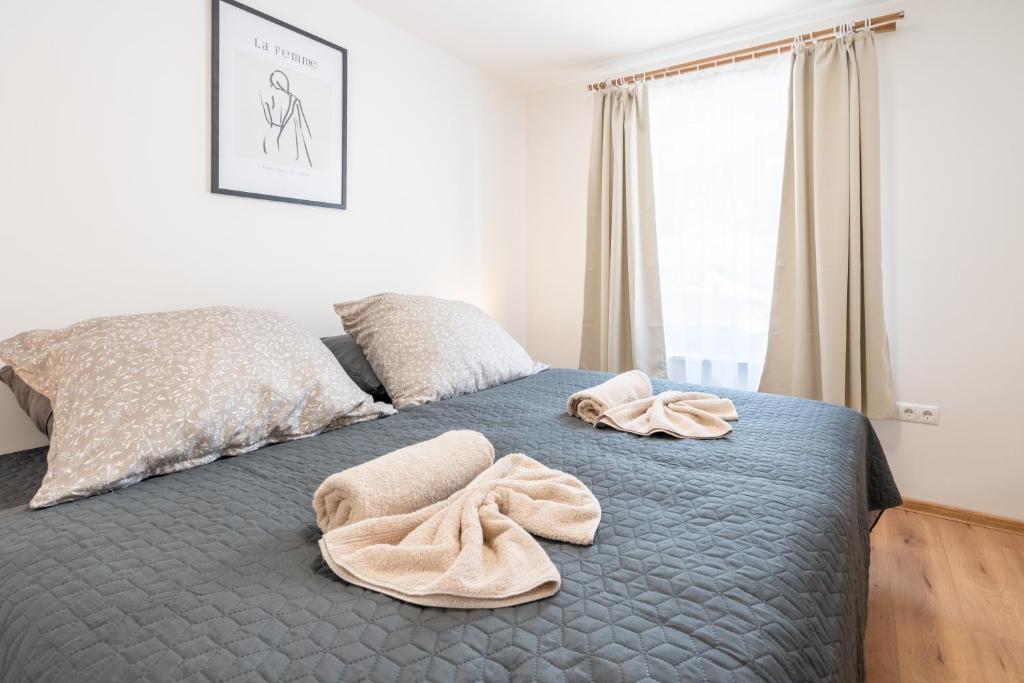Postel nebo postele na pokoji v ubytování revLIVING Apartments Gars am Kamp