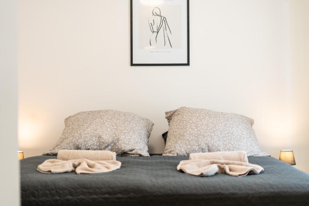 Postel nebo postele na pokoji v ubytování revLIVING Apartments Gars am Kamp